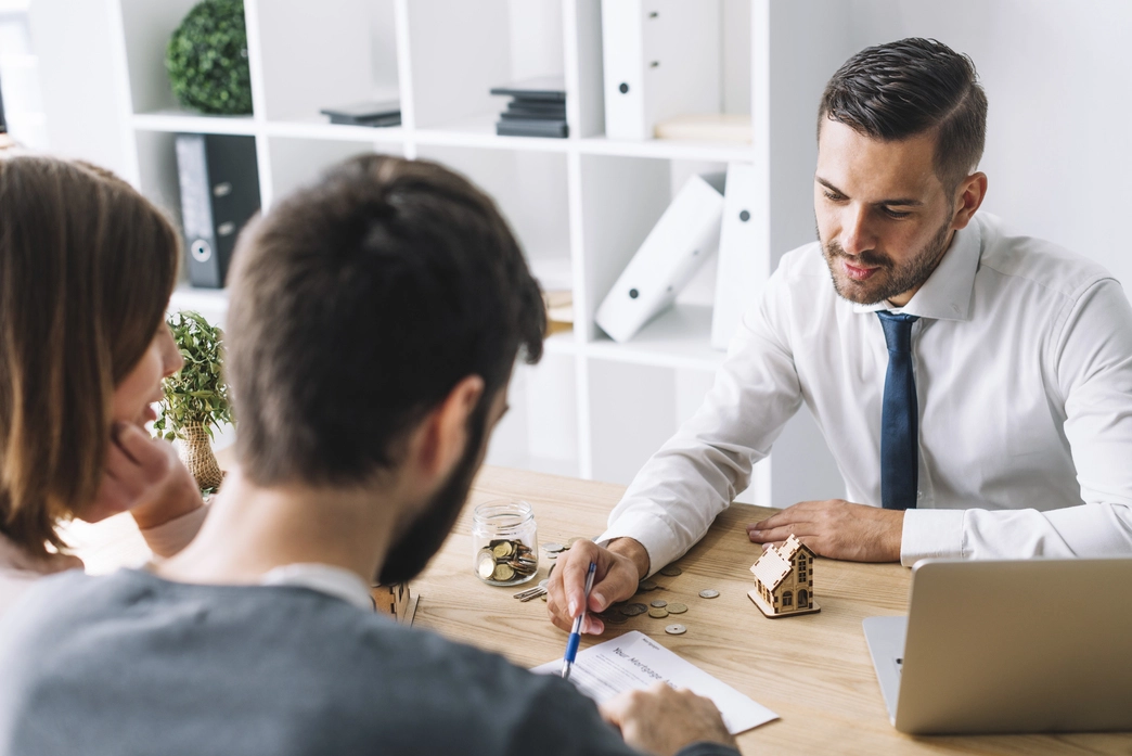 couple consulting with real estate agent
